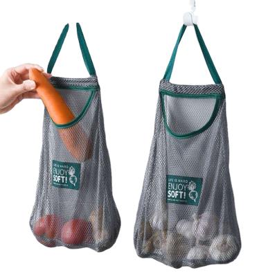 China Creative Wall Mounted Breathable Cavity Mesh Handled Portable Bag Kitchen Garlic Ginger Storage for sale