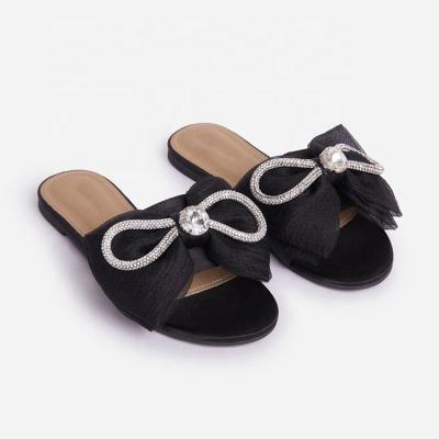 China Summer Fashion Trend Flat Sandals Ladies Round Toe Rhinestone Bowknot Slippers Outdoor Wear for sale