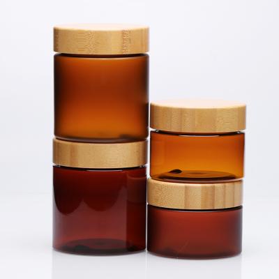 China Wide Mouth Cosmetic Food Grade Cosmetic Container 150ml Frosted Amber Pet Plastic Cream Jar Clear With Bamboo Lid for sale