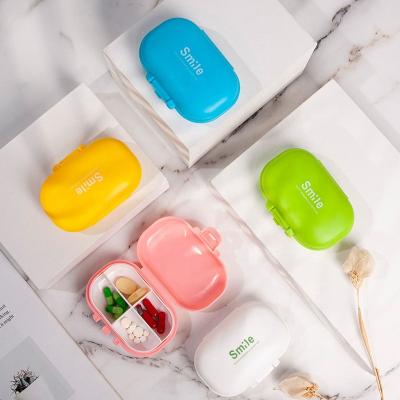 China Small Portable Mini Vitamin Pill Case Cute Plastic Storage Box Travel Pill Box Daily 4 Compartment Pill Container For Purse And Blister for sale