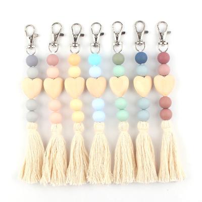 China Faux Fur Ball Pompom Chains Free Sample New Silicone Beaded Key Chain DIY Heart Shape Pearl Keychain Car Key Bag Pendant Wood Pendant With Tassels for sale