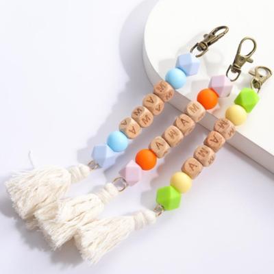 China Faux Fur Ball Pompom Chains Custom Message Letter Silicone Wood Beads Key Chain Cotton Rope Tassel Key Chain MOM Bag Charm Handmade MOM Gift Dangle for sale