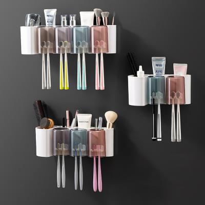 China Sustainable Household Black Self Adhesive Metal Wall Mount Toothpaste And Toothbrush Holder With Transparent Color for sale