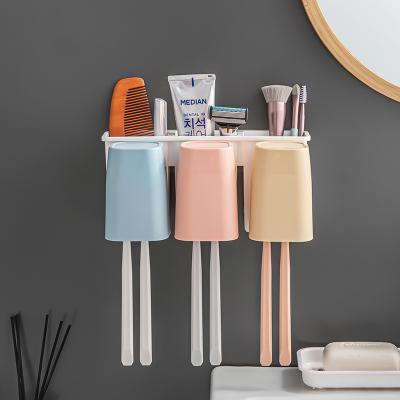 China Modern Cheap Wall Mounted Organizer Storage Toothbrush Holder Bathroom Toothbrush Set with 3 Cups for sale