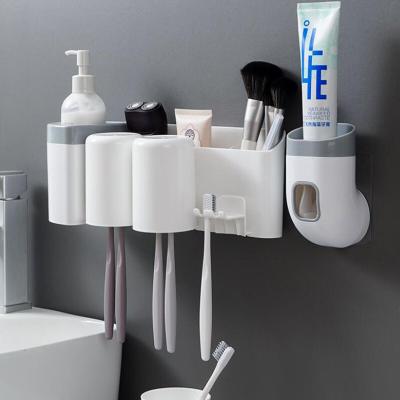 China Wall Mounted Type Automatic Toothpaste Dispenser Toothbrush Holder Wall Mount Holder Dustproof Bathroom Accessories Set Toothpaste Squeezer Tooth for sale