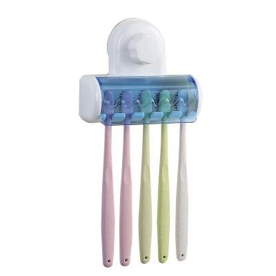 China Strong Suction Toothbrush Holder Stand Viable Wall Mounted Plastic Storage Holder With Cover Bathroom Accessories for sale