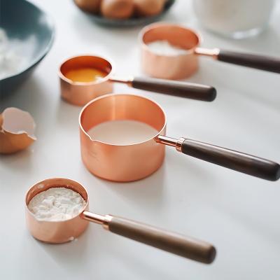 China Rose Gold Stainless Steel Measuring Viable Cups Coffee Milk Measuring Cups Set With Wooden Handle Kitchen Utensils Baking Sets for sale