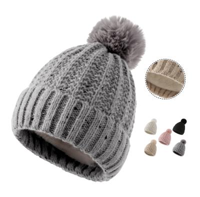 China Winter Women COMMON Thick Furry Plush Striped Knitted Hat With Fur Pom Pom Warm Fleece Lined Beanie Hat for sale