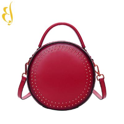 China New travel fashion rivet round bag cowhide small retro handbag with oblique female bag single-shoulder bag for sale