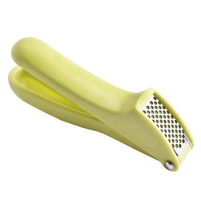 China Viable Kitchen Tools Manual Stainless Steel Garlic Press Vegetable Ginger Crushing Press With Rubber Handle for sale