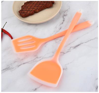 China Viable Color Kitchen Cooking Fried Shovel Stick Non Leaking Silicone Shovel Handle Long Fried Spatula for sale