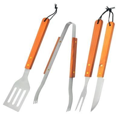 China Easily Cleaned 4 Piece Stainless Steel BBQ Accessories Wooden Handle with Fork Shovel BBQ Tool Kit for sale