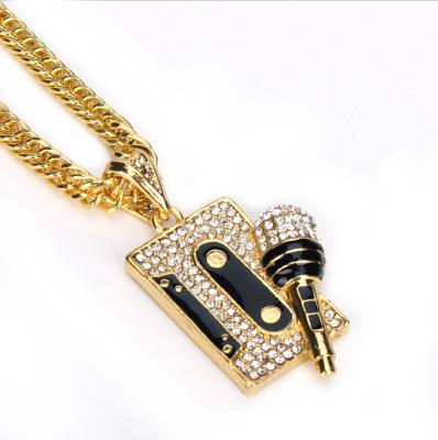 China HipHop Gold Black Crystal Paved Microphone And Stereo Glued Pendant Chain for sale