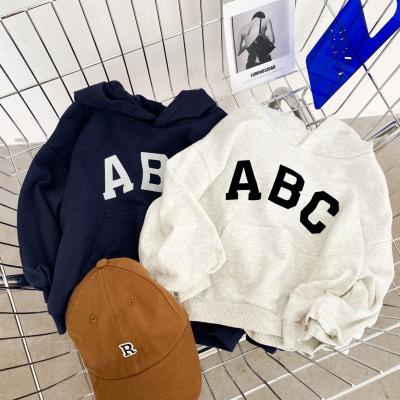 China 2021 children's clothing anti-shrinkage autumn and winter sweater letters cotton hooded pullover color-blocking sleeves tops children's clothin for sale