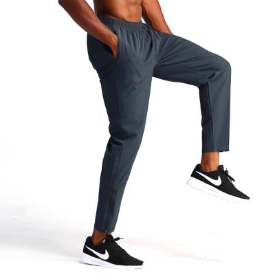 China Joggers Slim Fit Sports Breathable Custom Logo Men Tracksuit Joggers Pants Casual Long Running Pants Zipper Trousers for sale