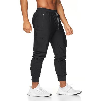 China Striped Sweatpants Running Pants Breathable Gym Joggers Workout Hot Pants Men With Zipper Pockets for sale