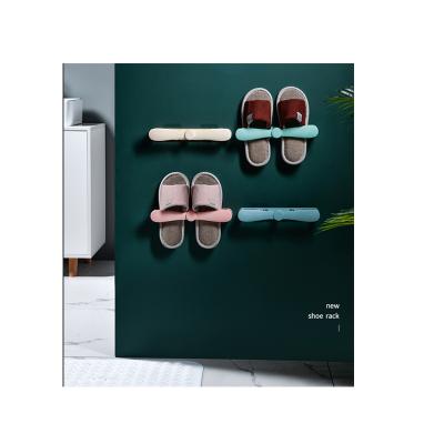 China Eco-friendly Wall Mounted Hanging Shoe Rack Plastic Bathroom Slippers Storage Rack for sale