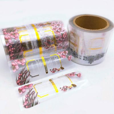 China Custom Printing Hot Clear Transparent Adhesive Roll Waterproof Logo Stickers Packaging Gold Stamping Foil Labels for sale