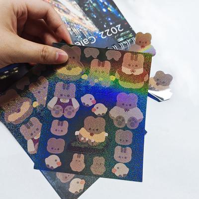 China Decorative Sticker Hd Popular Custom Printing Hologram Rainbow Film Glitter Cartoon Kiss Cut Self Adhesive Sticker Sheet for sale