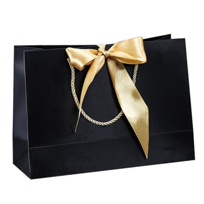 China Recyclable Wholesale Luxury Black Shoes Clothes Packing Paper Bags Logo Packaging Bags For Clothing Custom Made Indusdry for sale