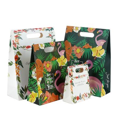 China Recyclable Paper Material Gift Pouch Bag And Feature Recyclable Christmas Green Gift Packing Bag for sale