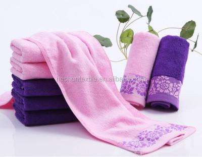 China Multifunction 100% Cotton Jacquard Advertising Compressed Logo Embroidery Towel With Satin for sale