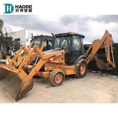 China Gebruikte 580m 580l  Backhoe Loader met top hydraulische pomp 7000 8000 kg Machine Gewicht Te koop