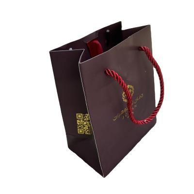 China Custom Materials Logo Recycled Paper Bag Luxury Dark Red Jewelry Packaging Bag for sale