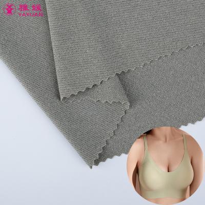 China Free Sample 29% Free Sample Stretch 29% Nylon Spandex 14% Polyester 57% Shiny Weft Knitted Fabric For T Shirt Bras for sale