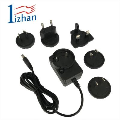 China New Style Plug In Interchangeable Universal Connection 12v 6v Wall Mount Power Supply Power Adapter Travel AC Adapter LZ0618-012050 for sale