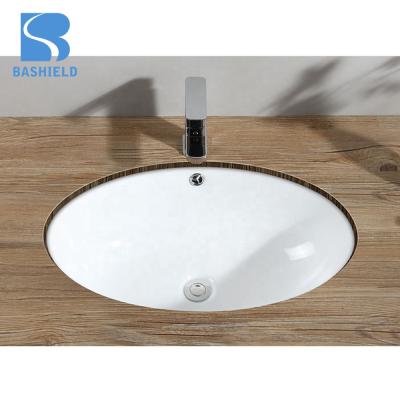 China Factory Hot Sale Modern Bathroom Big Ceramic Oval Undermount Wash Basin for sale