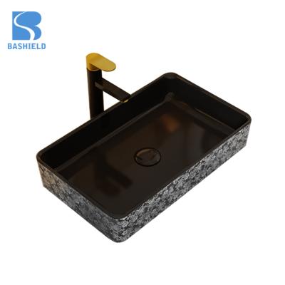 China Contemporary Delicate Appearance Wash Basin Types Ceramic Sink Black Golden Basin for sale