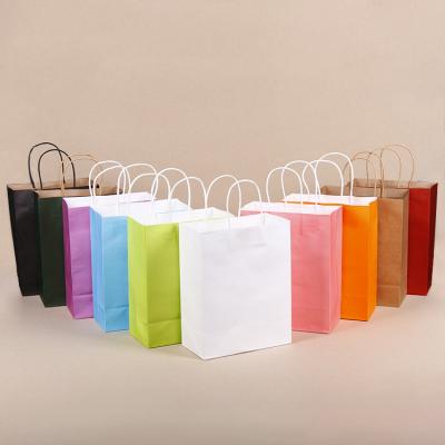 China 2020 customs aseptic wholesale paper bag printing logo gift shopping bag/kraft paper bag for clothes packing for sale