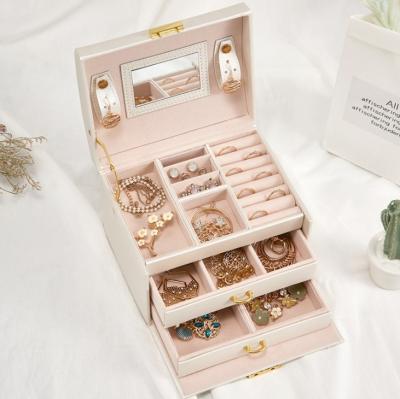 China Luxury PU Leather Jewelry Case Ring Women Girls Gift Box Packaging Portable Jewelry Box Bag With Mirror for sale