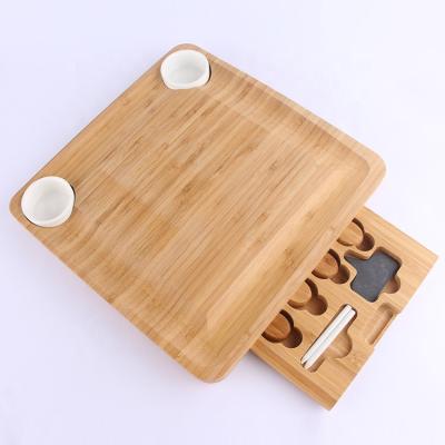 China Sustainable wooden bamboo cheese board set with cutlery in slide-out drawer including 4 stainless steel serving utensils for sale