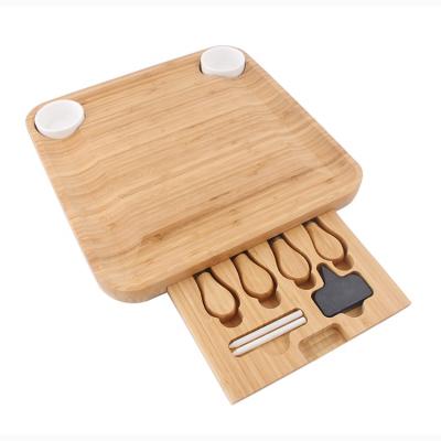 China Sustainable bamboo cutting chopper with cheese tools, cheese board and knife set with drawer for home use for sale