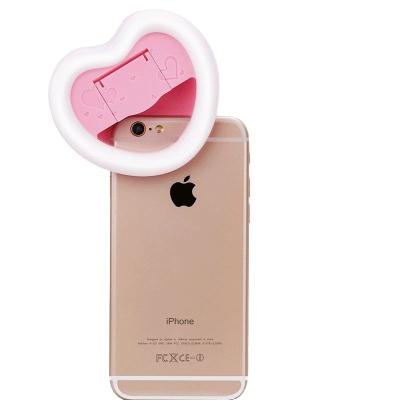 China New high quality classic compact rechargeable LED mobile phone ring heart-shaped light for sale