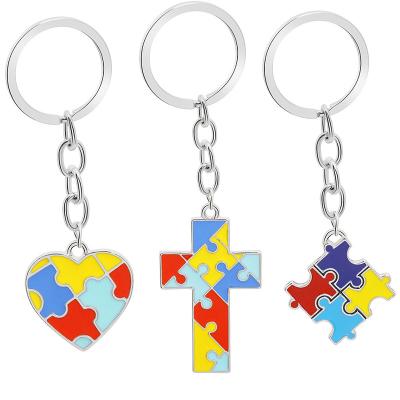 China Creative Souvenir Gift European And American Children Puzzles Mosaic Soft Color Oil Four-color Heart-shaped Cross Key Chain Pendant for sale