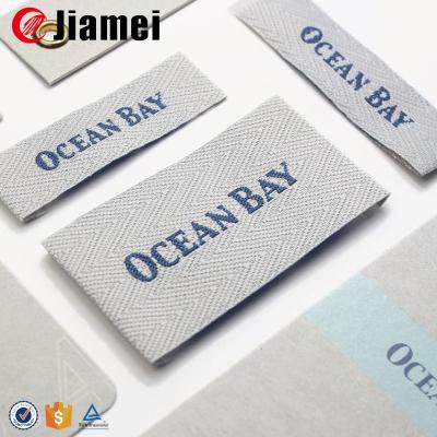 China Care Label Washable Wholesale Garment Woven Label Customized Apparel Embroidered Logo Printing for sale