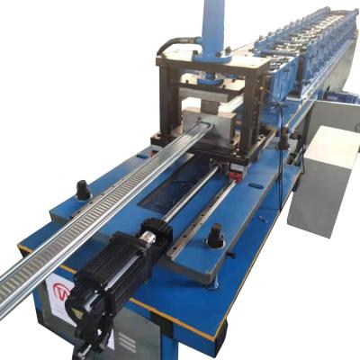 China High Accuracy Cut System Flying Cut Rolling Shutter Slatted Door Roll Forming Machine for sale