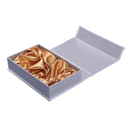 China Recyclable Luxury Silver Cardboard Skin Care Products Box Magnet Closed With Satin Line for sale