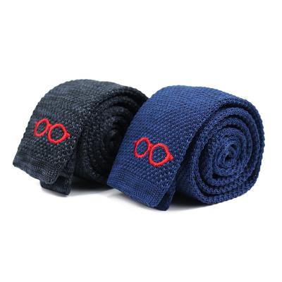 China 100% Handsome Stable Quality Polyester Tie Black Blue Designers Handmade Glasses Logo Pattern Knitted Neck Ties For Men for sale