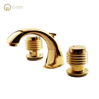 China GODI Faucets Three Holes Gold Bathroom Basin Faucet Metered Mixer Taps Hot And Cold Water Faucet for sale