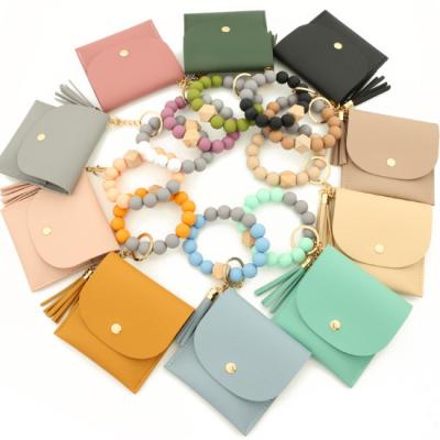 China High quality fashion silicone bead bracelet card bag food grade silicone bead bracelet PU women's purse key chain for sale