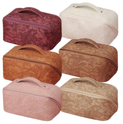 China 2023 New Durable Women's Makeup Bag Embossed PU Leather Multifunctional Makeup Bag Large Capacity Storage Toiletry Bag for sale