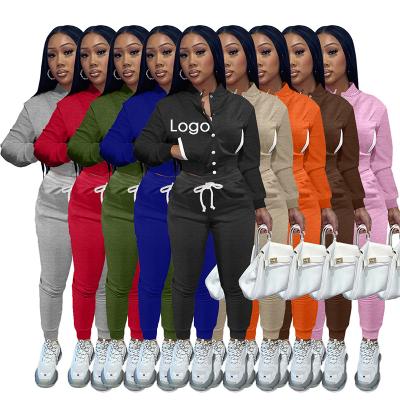 China Breathable 2022 High Quality Solid Color With Pocket Button Side Tracker Cropped Sweatshirt Hoodies And Sweatpants Sets for sale