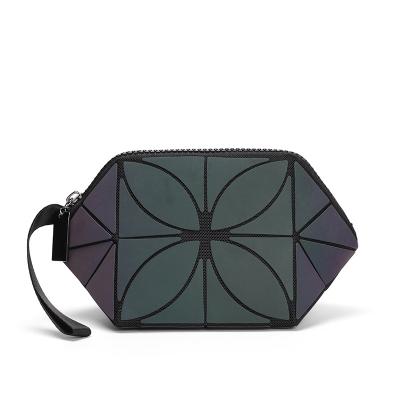 China New Style PU Leather Luminous Cosmetic Bag Portable Geometric Luminous Travel Handbag for sale