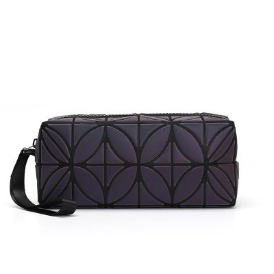 China PU Fashion Makeup Simple Bag Lingge Bag Geometric Luminous Wash Bag for sale