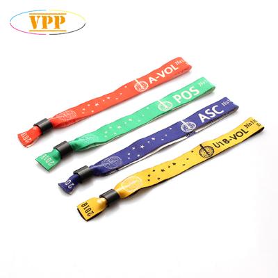 China Feng Shui Ticket Festival Cloth Fabric Wristband Customized Woven Wrist Band. for sale