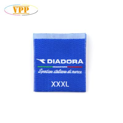 China Sustainable blue center fold textured sew in woven labels. for sale